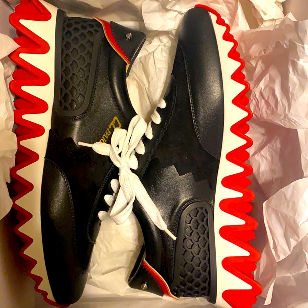 Brand new pair of Christian Tennis shoes